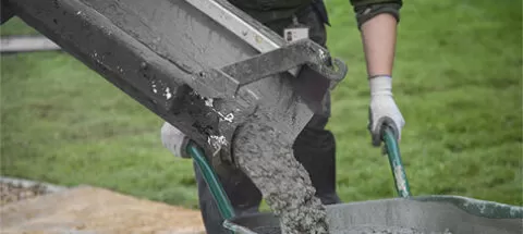 Ready mixed concrete poured into a wheelbarrow | EasyMix Concrete