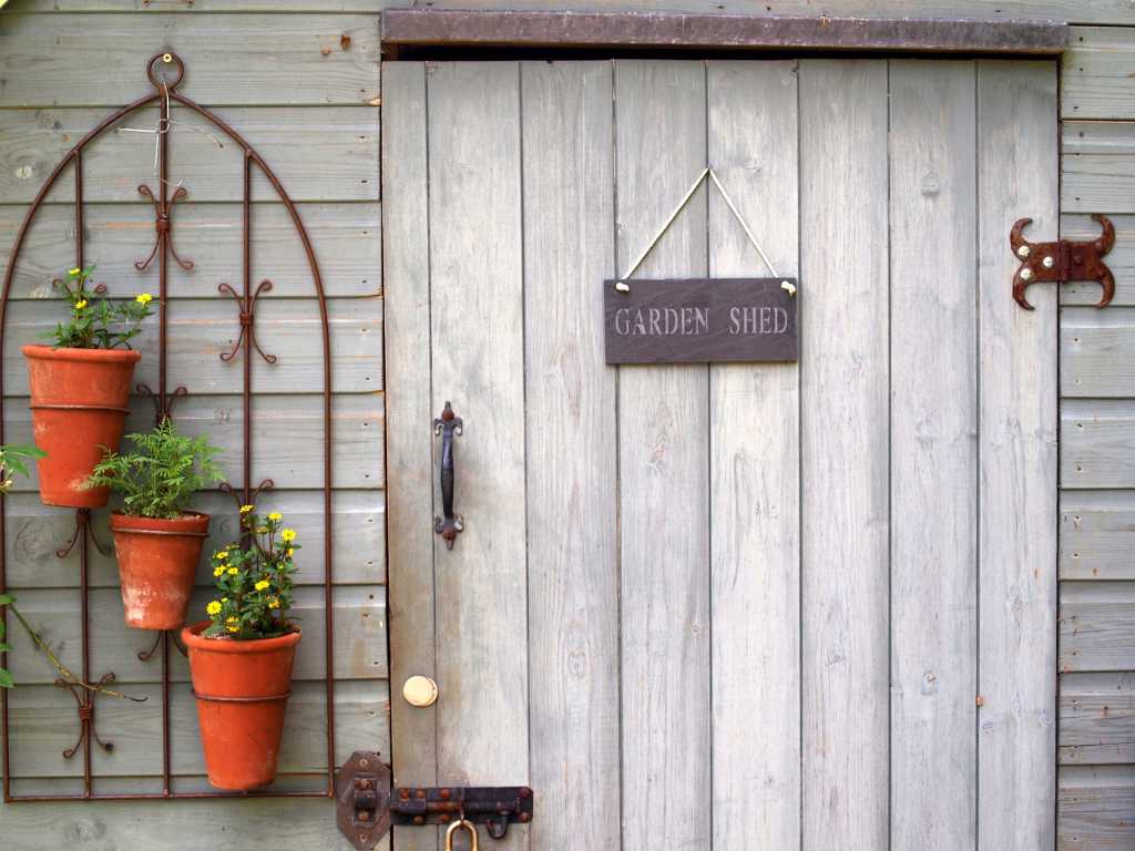 Garden shed door and potted plants | EasyMix Concrete