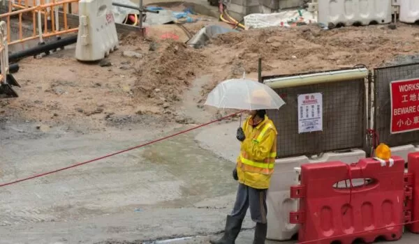 Pouring concrete in the rain on a construction site | EasyMix Concrete 